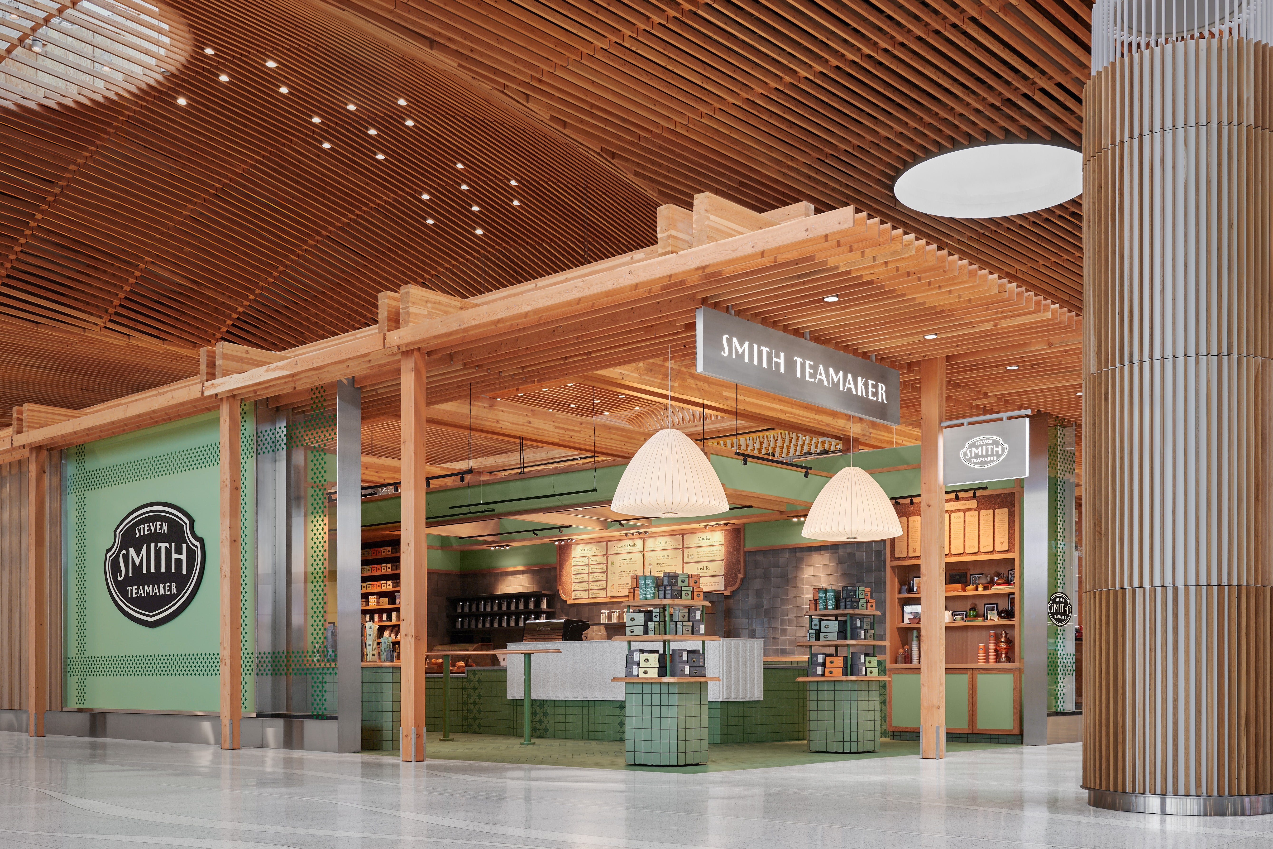 Smith Teamaker store interior with wooden ceiling and green walls at Portland International Airport.