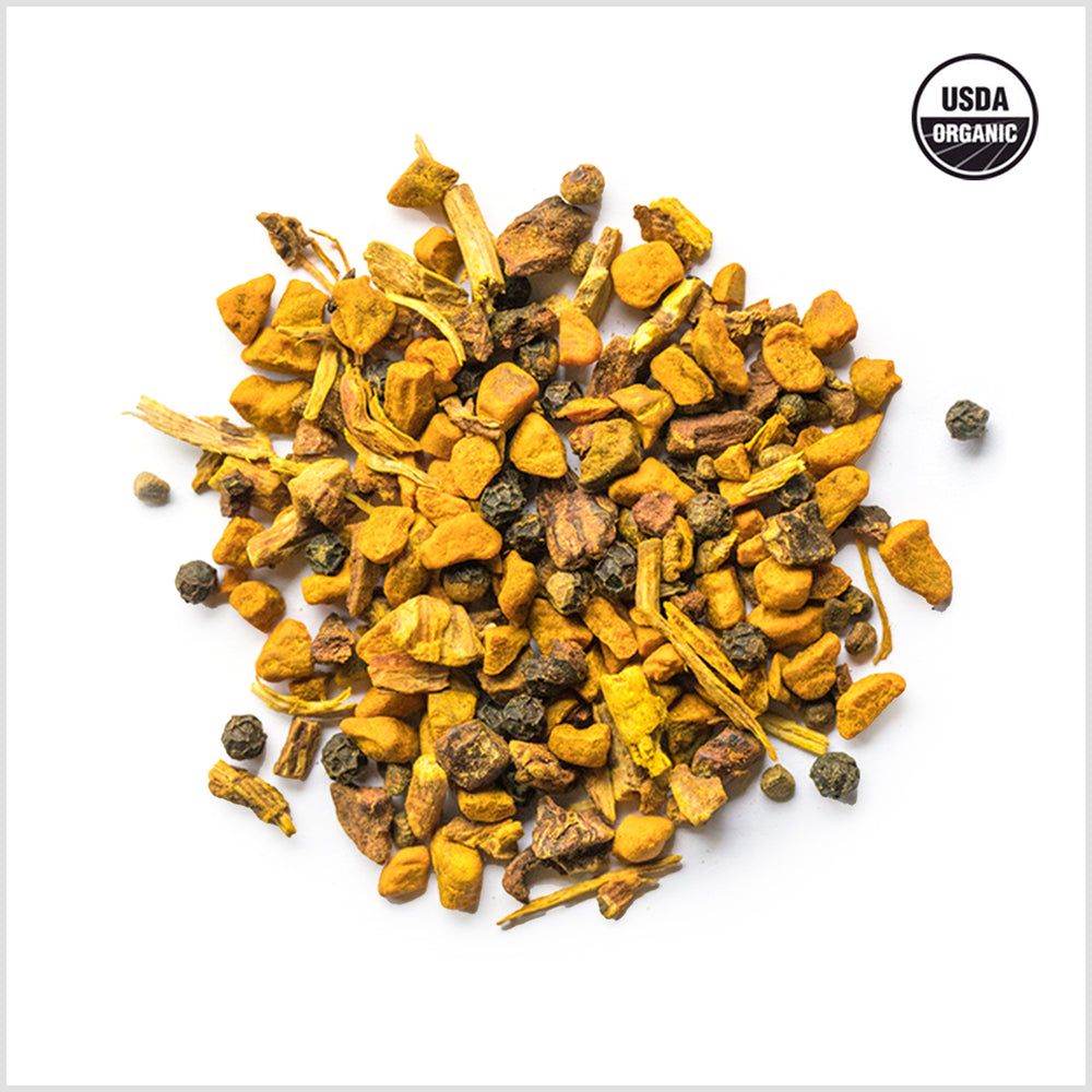 Circular pile of dried turmeric, black pepper and sarsaparilla. 