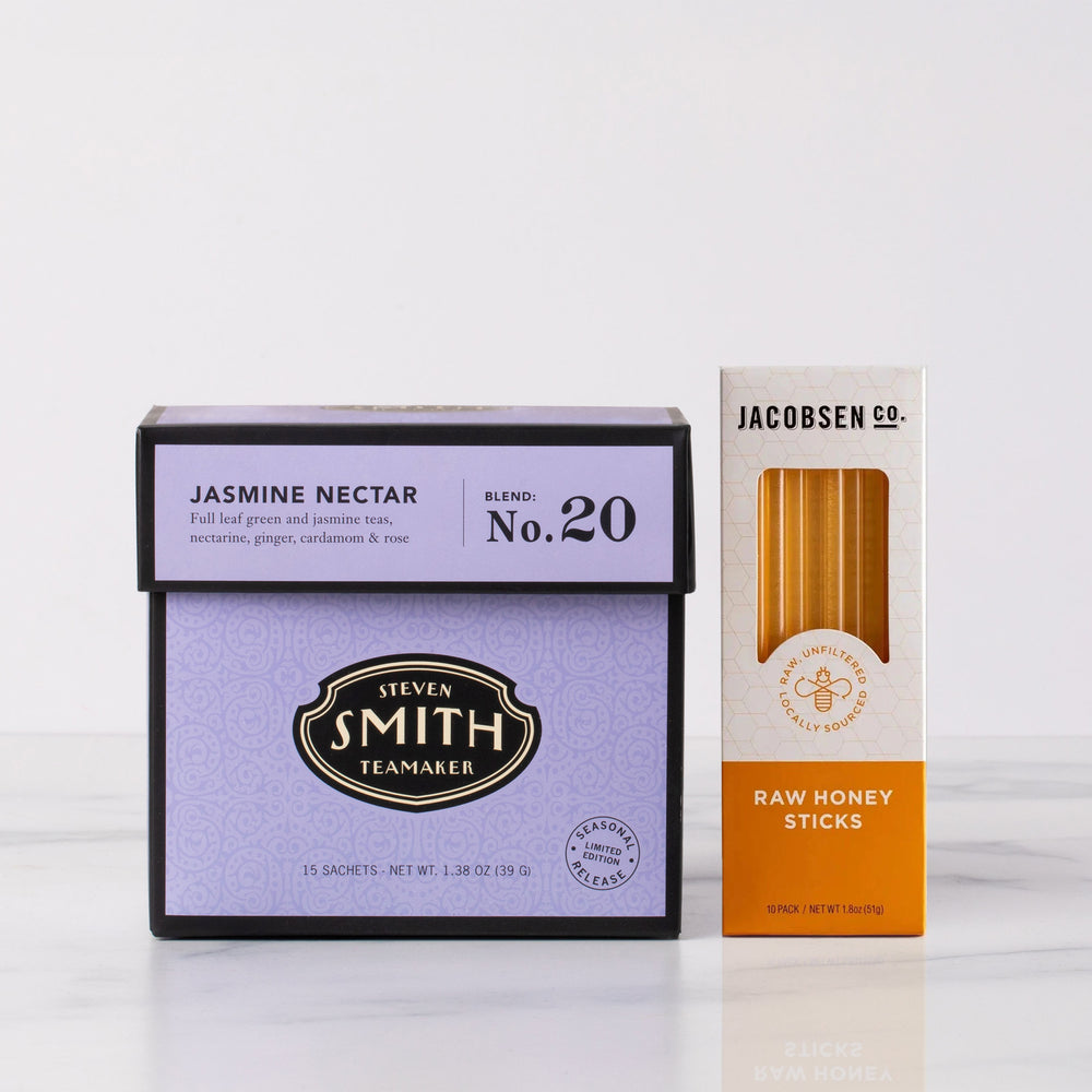 Two product boxes, one for Steven Smith Jasmine Nectar tea and the other for Jacobsen's Raw Honey Sticks, on a white background.