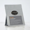 Grey bag with black Lord Bergamot label and Smith logo.