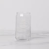 Rounded can shapped glass on a marble background.