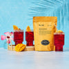 Orange bag of Hibiscus Mango iced tea next to three red glasses of iced tea.