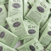 A pile of overwrapped sachets of White Petal white tea.