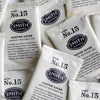 A pile of overwrapped sachets of Soothe Sayer wellness tea.