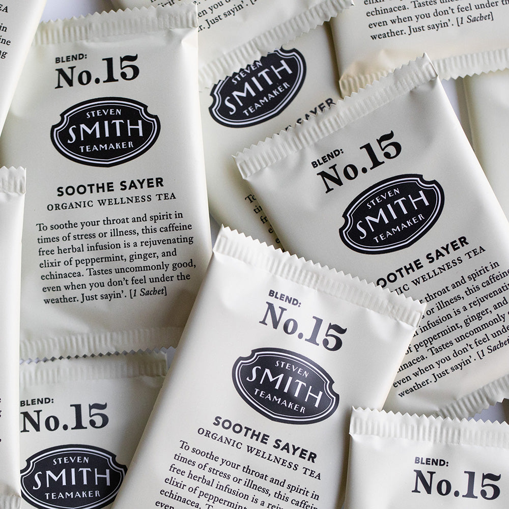 A pile of overwrapped sachets of Soothe Sayer wellness tea.